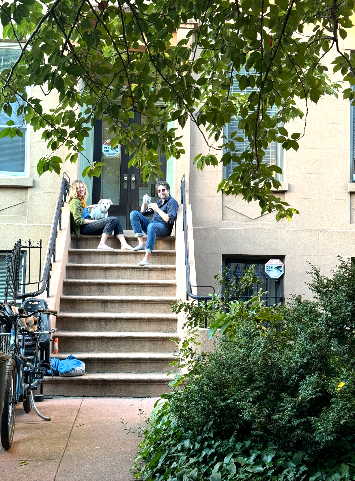 Kim and Yuri sitting on their stoop