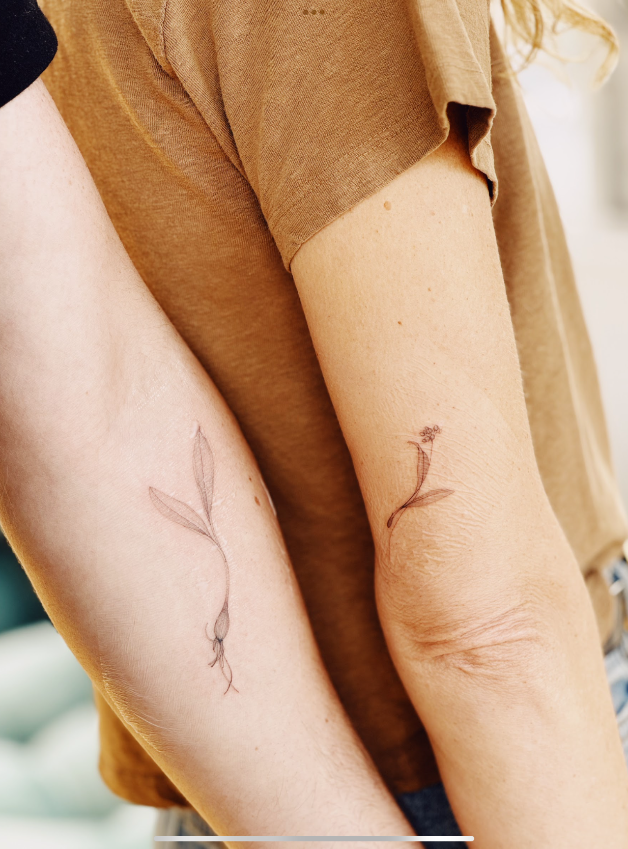 Kim and Yuri showing their ramp tattoos